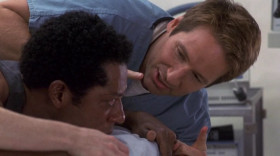 - For the love of everything good and holy, get this goddamn thing out of me!
- You're gonna be okay. Cut him open. Let's get this thing.
- Cut me open? There goes your Christmas gift, Judas!
- It's moving down his leg.
- What do we do?
- Maybe amputate.
- Whoa, don't take the leg! Don't let 'em take my leg.
- Is there anything else you can do? He thinks he's an athlete.
- Doctor, look.
- It's heading for his testicles.
- Take it! Take the leg!
- Wait, wait! It's going the otherway.
- Give me some forceps. I might be able to catch it in his colon.
- How're you going in?
- Rectally.
- I'll get the lubricant.
- No time for lubricant.
- There's always time for lubricant!
- Flip him!
- Try to relax.
- Everything's gonna be okay.
- I'll shove this gurney up your ass! See if you relax, Ira.
<...>
- It's over, it's over.
- Don'tyou ever do that again!
- The size ofthat thing insideyou! It was like this! You took it like a man.