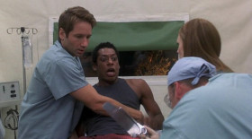- For the love of everything good and holy, get this goddamn thing out of me!
- You're gonna be okay. Cut him open. Let's get this thing.
- Cut me open? There goes your Christmas gift, Judas!
- It's moving down his leg.
- What do we do?
- Maybe amputate.
- Whoa, don't take the leg! Don't let 'em take my leg.
- Is there anything else you can do? He thinks he's an athlete.
- Doctor, look.
- It's heading for his testicles.
- Take it! Take the leg!
- Wait, wait! It's going the otherway.
- Give me some forceps. I might be able to catch it in his colon.
- How're you going in?
- Rectally.
- I'll get the lubricant.
- No time for lubricant.
- There's always time for lubricant!
- Flip him!
- Try to relax.
- Everything's gonna be okay.
- I'll shove this gurney up your ass! See if you relax, Ira.
<...>
- It's over, it's over.
- Don'tyou ever do that again!
- The size ofthat thing insideyou! It was like this! You took it like a man.