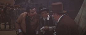 <b>Mayor of Boracho:</b> - You're the guest of honor.
<b>Professor Fate:</b> - Well, I don't want to be a guest of honor.
<...>
<b>Mayor of Boracho:</b> - You're gonna attend the meeting tonight... or, by jumped-up Harry, you're gonna be guest of honor at a necktie party!
<b>Maximilian Meen:</b> - Necktie? Well, what kind of cheap present is that?