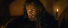 Far over the misty mountains cold
To dungeons deep and caverns old
We must away 'Ere break of day
To find our long-forgotten gold.
The pines were roaring on the height
The winds were moaning in the night
The fire was red, it flaming spread
The trees like torches blazed with light...