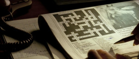 - I trust you had a pleasant trip. Fascist.
- I beg your pardon?
- "System of Government characterised by extreme dictatorship." Seven across.
- Oh, I see. It's "fascism."
- Fascism. Wonderful.