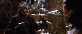 - Joker-man, what you do with all your money?
- You see, I'm a guy of simple taste. I enjoy... dynamite... and gunpowder... and gasoline.
- What the...? And you know the thing that they have in common? They're cheap.