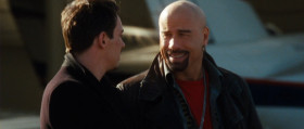 - Here, I got you a little something to keep you going. Wherever it is you are going.
- Yeah, man. You know I got this sense... that you're going to take your act on the road pretty soon here. Courtesy of the very appreciative
government.