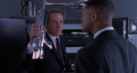 - Kay. Give the kid a weapon.
- Series 4 De-atomizer.
- Now, that's what I'm talking about.
- Noisy Cricket.
- Hey, Kay, no, no. Come on, man. You get a Series 4 De-atomizer, I get a little midget Cricket?
- Whoa, kid!
- Feel like I'm gonna break this damn thing.