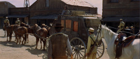 - What do you think they're carrying in the coach?
- It'd be easy to find out. Get up close to it and take a look inside. If they fire at you, you know it's gold.
- Not a bad idea.