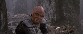 - Don't you ever get tired of reading that book?
- No.
- Well, what's in it, anyway?
- Things.
- Oh, for Christ's sake!
- It is called Talmon. It contains the words of our great teacher, Shismar.
- I suppose you have to know the Drac language to read it, right?
- It would help.
- So teach me the Drac language.
- It is not for you, Davidge.
- Shismar is too good for us humans, is that it?
- Not too good for humans, but too good for you.
- Now you're a judge of character.
- Do you not remember what you say about Shismar?
- Well, maybe you forgot what you said about Mickey Mouse!
- That was wrong. I did not mean it.
- I didn't mean what I said about Shismar, either.