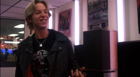 - The flagship of the entire Dominator line. The MX-10. I have a pair of these myself. 30 inches of thigh-slappin', blood-pumpin' nuclear brain damage!
- Bitchin'! Hey, what's the fucking cost?
- That's the bitchin' part about it. It don't matter. If you can't afford it, fuckin' finance it! Yeah! Whoo! So what if it's as big as a Subaru and costs as much! You'll never have to trade this in. This is gonna be with you for the rest of your life. And when you die, they can bury you in it!