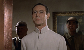 - One million dollars, Mr. Bond. You were wondering what it cost.
- As a matter of fact, I was.
- Forgive my not shaking hands. It becomes a bit awkward with these. A misfortune. You were admiring my aquarium.
- Yes. It's quite impressive.
- A unique feat of engineering, if I may say so. I designed it myself. The glass is convex, 10 inches thick, which accounts for the magnifying effect. Minnows pretending they're whales.
- Just like you on this island, Dr. No.
- It depends, Mr. Bond, on which side of the glass you are.