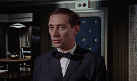 - According to your instructions, I've planned for SPECTRE to steal from the Russians their new Lektor decoding machine. For this we need the services of a female member of the Russian
Cryptograph section in Turkey and the help of the British Secret Service. Naturally, neither the Russians nor the British will be aware that they are now working for us.
- Number Three, is your section ready to carry out Kronsteen's directives?
- Yes, Number One. The operation will be organized according to Kronsteen's plan. I've selected a suitable girl from the Russian Consulate in Istanbul She's capable, cooperative, and her loyalty to the state is beyond question.
- And you're absolutely sure she believes you're still Head of Operations for Soviet Intelligence?
- It is unlikely she would know I'm now working for SPECTRE. Moscow has kept my defection secret from everyone but a few members of the presidium.
- For your sake, I hope so. Kronsteen, you are sure this plan is foolproof?
- Yes, it is, because I have anticipated every possible variatio of counter-move.
- What makes you think that M, the Head of British Intelligence, will oblige you by falling in with your plan?
- For the simple reason that this is so obviously a trap. My reading of the British mentality is that they always treat a trap as a challenge.