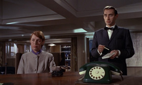 - According to your instructions, I've planned for SPECTRE to steal from the Russians their new Lektor decoding machine. For this we need the services of a female member of the Russian
Cryptograph section in Turkey and the help of the British Secret Service. Naturally, neither the Russians nor the British will be aware that they are now working for us.
- Number Three, is your section ready to carry out Kronsteen's directives?
- Yes, Number One. The operation will be organized according to Kronsteen's plan. I've selected a suitable girl from the Russian Consulate in Istanbul She's capable, cooperative, and her loyalty to the state is beyond question.
- And you're absolutely sure she believes you're still Head of Operations for Soviet Intelligence?
- It is unlikely she would know I'm now working for SPECTRE. Moscow has kept my defection secret from everyone but a few members of the presidium.
- For your sake, I hope so. Kronsteen, you are sure this plan is foolproof?
- Yes, it is, because I have anticipated every possible variatio of counter-move.
- What makes you think that M, the Head of British Intelligence, will oblige you by falling in with your plan?
- For the simple reason that this is so obviously a trap. My reading of the British mentality is that they always treat a trap as a challenge.