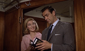 - I've rarely seen a handsomer couple. Mr. And Mrs. David Somerset.
- Your name's Caroline.
- Caroline. I like that name.
- You're accompanying me on a business trip on the way back to Derbyshire.
- Twelve children?
- No children.
- Not even one little boy?
- Niet.