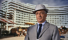 - But what's on your mind? I'm on holiday.
- Not anymore, you're not. Signal from London.
- Might have known M wouldn't book me into the best hotel in Miami Beach out of pure gratitude.
- He asked us to keep an eye on him for you.
- Auric Goldfinger. Sounds like a French nail varnish.
- He's British, but he doesn't sound like it. Big operator. Worldwide interests, all apparently quite reputable. Owns one of the finest stud farms in the States.