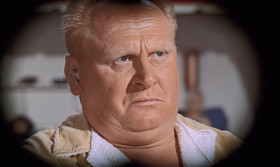 Now hear this, Goldfinger. Your luck has just changed. I doubt very much if the Miami Beach police would take kindly to what you're doing. Nod your head
if you agree. Nod! Good. Now start losing, Goldfinger. Shall we say, $10,000? No, let's be generous. Let's make it 15,000.
