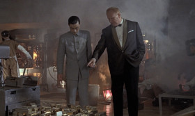 - Smuggling is an art, Mr. Ling. And art requires... In this case, the bodywork of my Rolls Royce is 18-carat gold. We dismantle it here, reduce the gold in this special furnace to ingots, which in turn will be released on the board and weigh approximately two tons. I make six trips a year to the continent in the Rolls Royce, Mr. Ling.
- It would be wiser to suspend your other activities.
- Now, Mr. Ling, please assure your principals Operation Grand Slam will have my undivided attention.