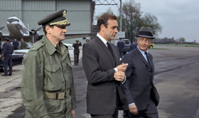 - Three more ticks and Mr. Goldfinger would have hit the jackpot. Did you get him?
- Not yet, but he won't get far.
- And Pussy?
- She helped us switch the gas in the canisters. By the way, what made her call Washington.
- I must have appealed to her maternal instincts.
- Come on, James. Get aboard. You can't keep the President waiting.
- Special plane, lunch at the White House. How come?
- The President wants to thank you personally.