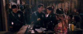 <b>John Spartan:</b> - Oh, God. This is fantastic. You guys gotta try one.
<b>Lenina Huxley:</b> - Just don't ask where the meat comes from.
<b>John Spartan:</b> - Huxley, what's that supposed to mean?
<b>Lenina Huxley:</b> - Do you see any cows around here, detective?
<b>John Spartan:</b> - Que es este carne?
<b>Saleswoman:</b> - Este carne es de rata!
<b>John Spartan:</b> - Rat? This is a rat burger? Not bad. As a matter of fact, it's the best burger I've had in years.