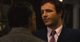 Santino, come here. What's the matter with you? I think your brain is going soft... from all that comedy you're playing with that young girl. Never tell anybody outside the family what you're thinking again.