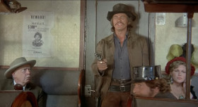 Folks, me and my friends are gonna put on a little wild west show for you! Some of you might have heard about it. It's called a hold up! Now don't get scared or do anything stupid and you'll be all right.