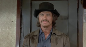 Folks, me and my friends are gonna put on a little wild west show for you! Some of you might have heard about it. It's called a hold up! Now don't get scared or do anything stupid and you'll be all right.