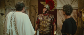 He's the only good chariot mechanic in this damn town. Why in Hades are we here except to please a brainless emperor! My nerves are shot to hell.
