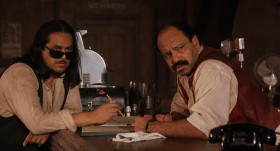 - Excuse me. But I used to work in a bar, so I know what it's like to wait on people. And I want to tell you that the service here needs immediate improvement.
- What do you mean?
- What do I mean? Our waiter, where is he? Don't tell me he's still in the bathroom. He never came back to see if we wanted anything else. He never brought us our check. We wanted our check so we could get the hell out of here. Here. This should be sufficient. And don't be expecting a tip.
- If you don't treat me good, I won't ask you out.
- And your beer tastes like piss.
- We know! Because we piss in it! That's not all. Bad beer, bad service. Don't they know not to come in?