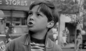 - Rachel's not allowed to eat ham.
- Well, that's because she's Jewish.
- Why don't Jewish people eat ham?
- Oh, Mike, do stop asking questions.
- But why don't they?
- Well, it's their religion. It's different from ours.
- Why?
- Mike, for goodness sake!
- Look, Mum, that's where Rachel goes to church.
- That's the synagogue.
- Can I go with her one day? She goes to service on Saturdays instead of Sundays.
- Michael, you must never do that.
- Why not?
- Well, because you're a Catholic. It would be a sin.
- A bad one?
- Yes, a very bad one.
- Gosh!