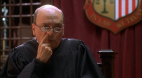 Gentlemen, just drop your guns. Everyone else, stay seeted. Judge... stick your finger up your nose... <...> I'm glad we understand, who's in charge now. So judge... This whole deal was a lie. Is that right? Keep that finger in your nose!
